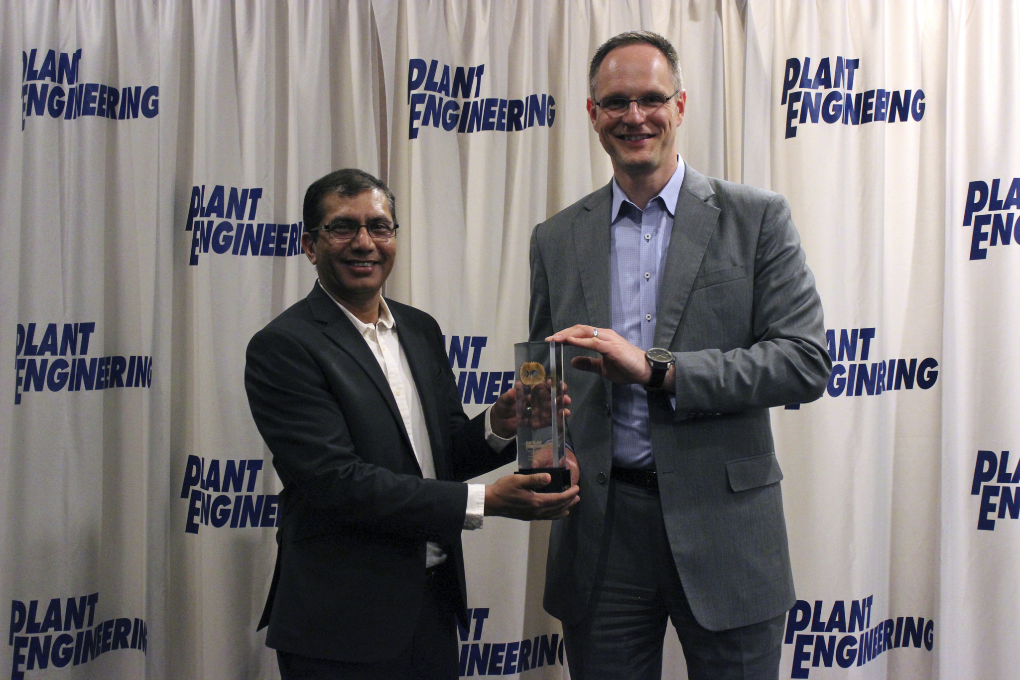 Nav Sharma and Friedmar Rumpel of Sullair accept the Plant Engineering award