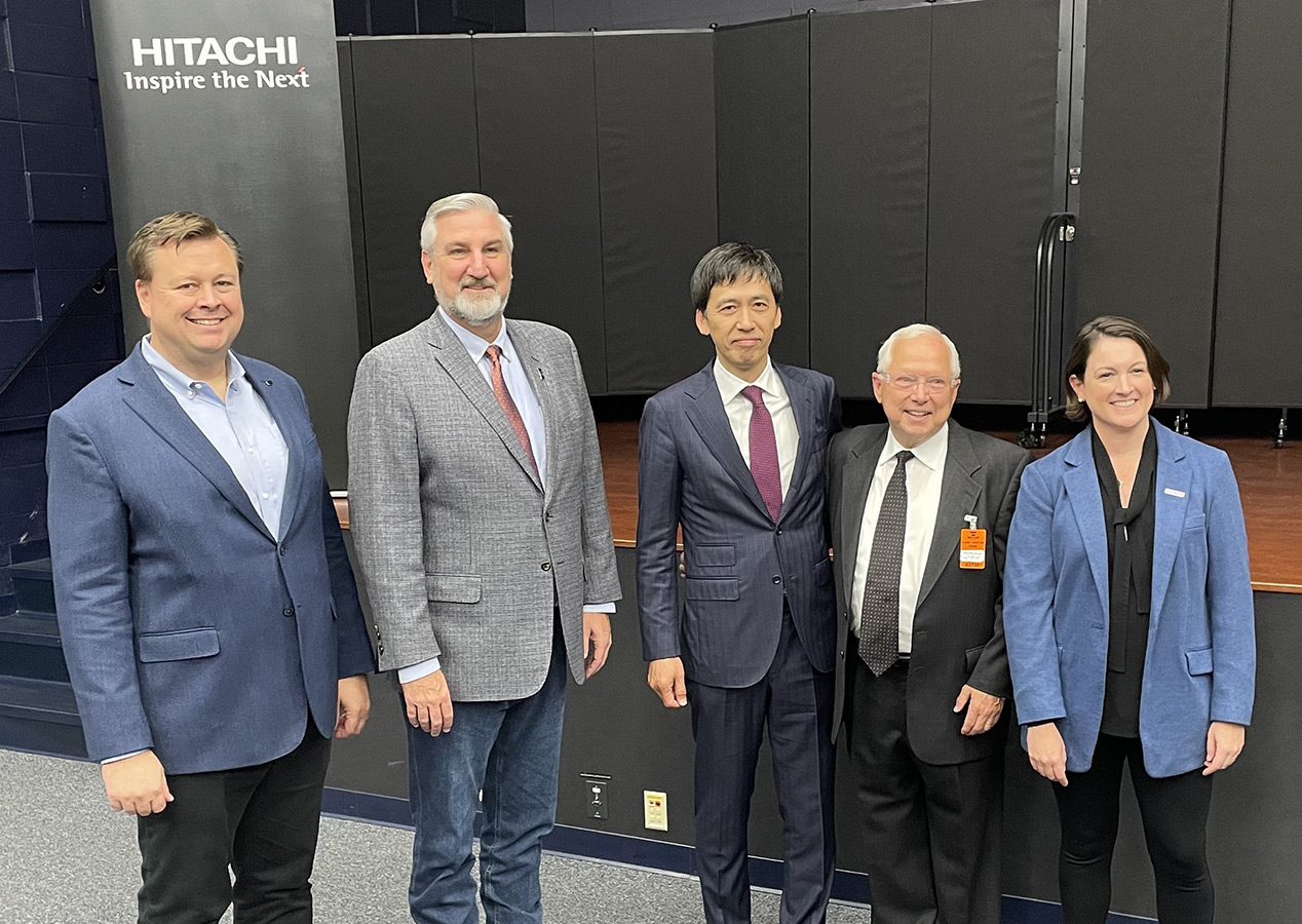 Pictured: John Randall - Hitachi Global Air Power, Governor Eric Holcomb, Shimada Keiichi - Hitachi, Kate Fox Wood - AEM