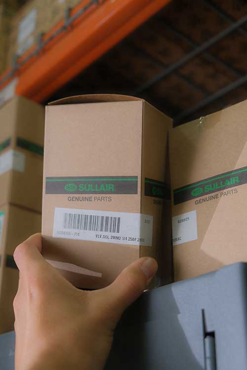Grabbing Genuine Part Off Shelf
