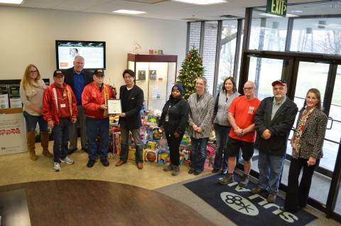 Toys for Tots representatives present Sullair COO & Executive Vice President Charlie Takeuchi with a plaque