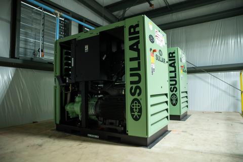 Sullair rotary screw compressor installation with open panels