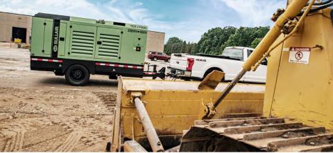 Sullair Mid-Range being towed behind a truck