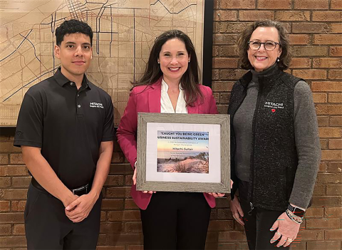 Ramiro Aguilar, Sustainability Impact Lead; Jennifer Ohlinger, Senior Communications Manager; and Susan Poncher, Senior HRIS Advisor accept the “Caught YOU Being Green” Award for Hitachi Global Air Power.