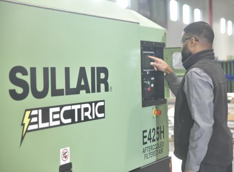 Jerel Cole operates the Sullair E425H electric portable air compressor.